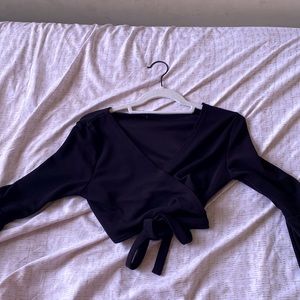 Black, long sleeve, tie top. Very cute and the material is really nice!!